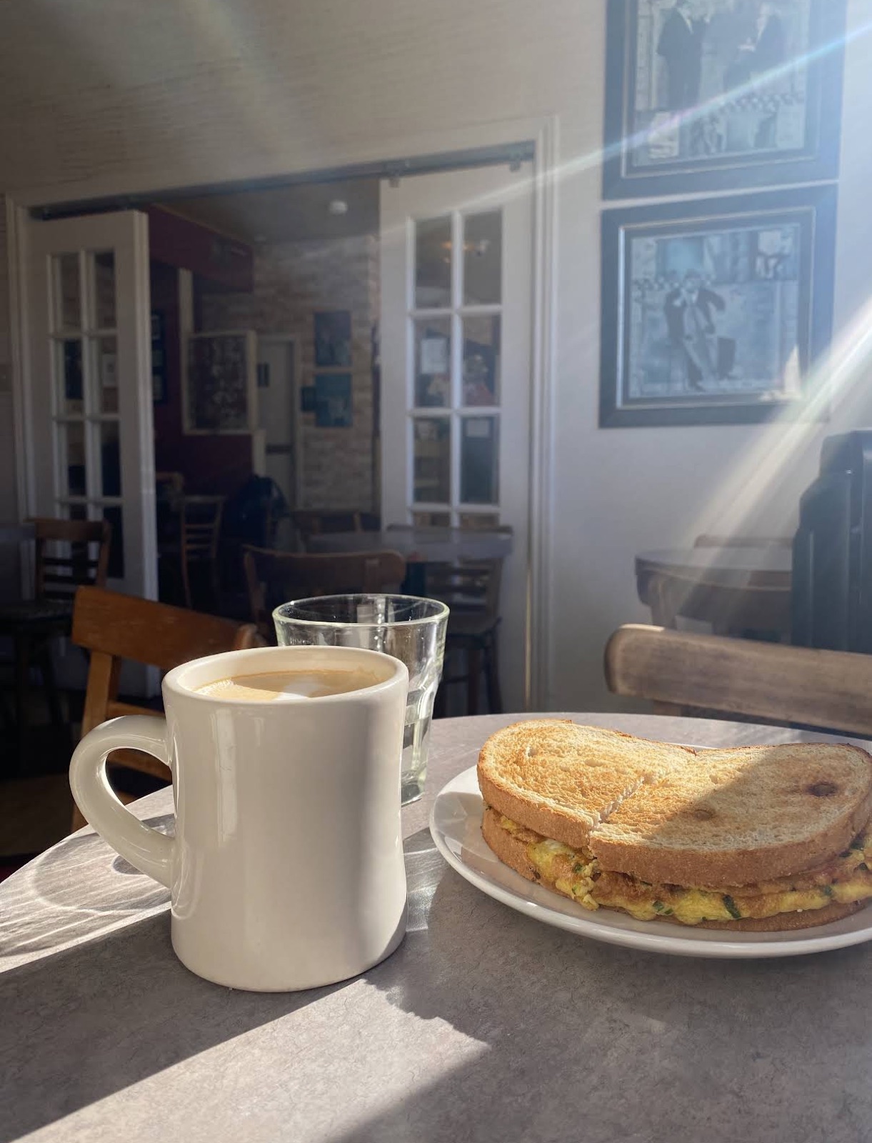 Coffee in sunlight inside the cafe