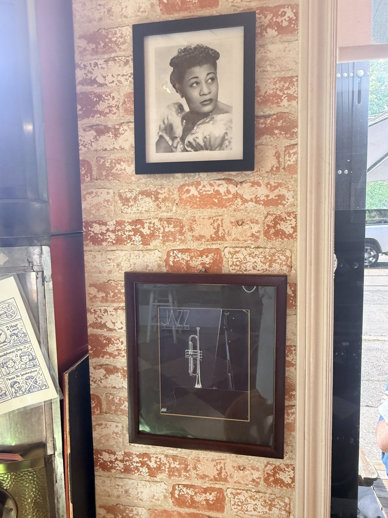 Jazz photographs on the cafe brick wall